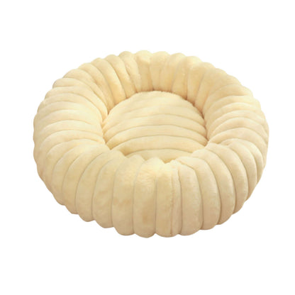 plush pet bed for winter in soft cream color with a cozy round design for pets