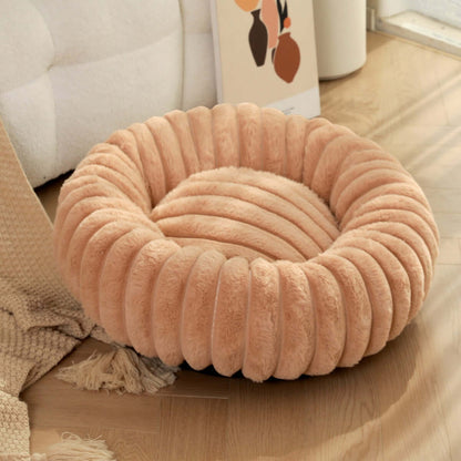 plush pet bed for winter in soft, round design, perfect for keeping pets cozy during cold months.